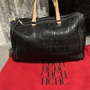 Authentic Carolina Herrera bag black woth tan handles. Very good condition.